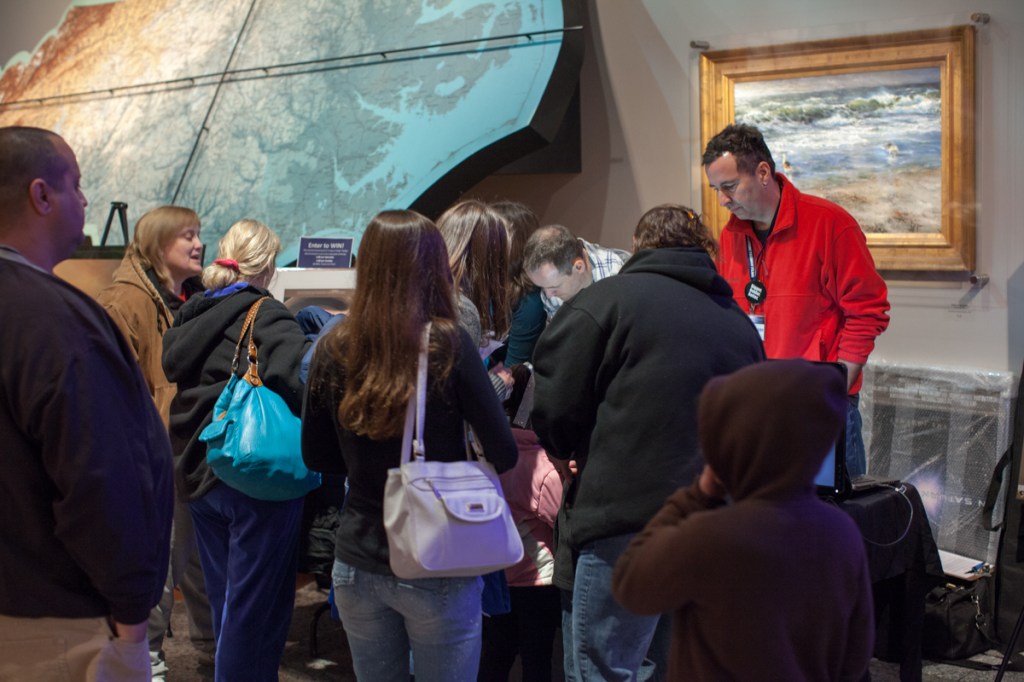 People lined outside the booth.