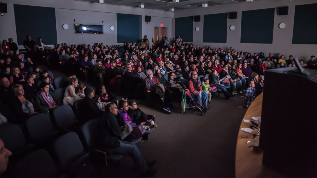 Packed audience watching In Saturn's Rings